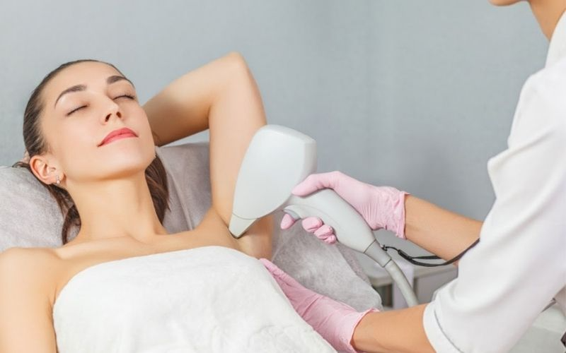 A person getting laser hair removalAI-generated content may be incorrect.